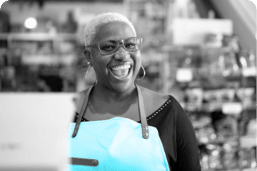 Woman smiling with blue apron